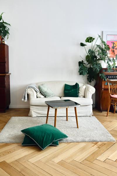 Herringbone pattern hardwood floor in furnished room